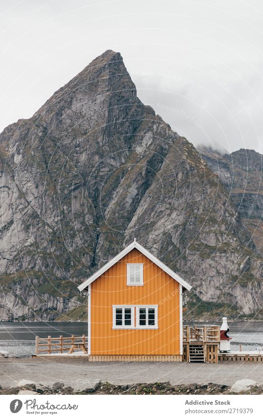 Cabin on lake shore Lake Hut Mountain Nature Landscape House (Residential Structure) breathtaking Water Coast Sky Vantage point Fog Majestic Calm Peak