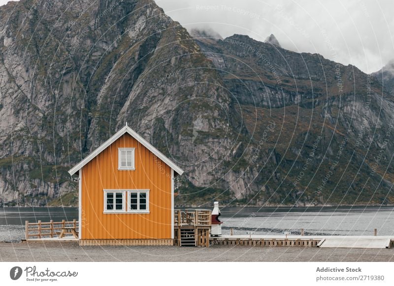 Cabin on lake shore Lake Hut Mountain Nature Landscape House (Residential Structure) breathtaking Water Coast Sky Vantage point Fog Majestic Calm Peak