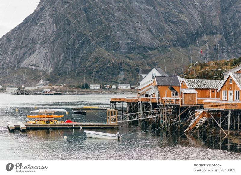 Boats on mountain lake Watercraft Lake Village Mountain Nature Landscape House (Residential Structure) breathtaking Coast Sky Vantage point Majestic Calm Peak