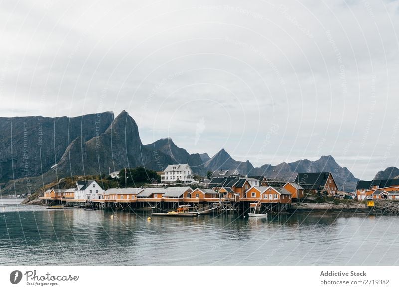 Boats on mountain lake Watercraft Lake Village Mountain Nature Landscape House (Residential Structure) breathtaking Coast Sky Vantage point Majestic Calm Peak