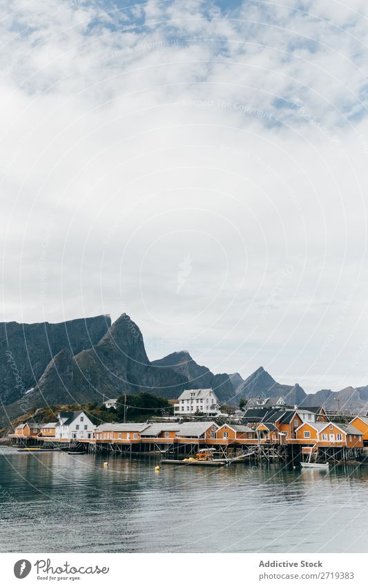 Boats on mountain lake Watercraft Lake Village Mountain Nature Landscape House (Residential Structure) breathtaking Coast Sky Vantage point Majestic Calm Peak