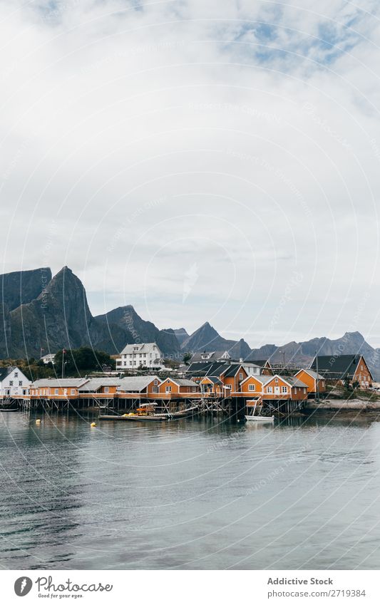 Boats on mountain lake Watercraft Lake Village Mountain Nature Landscape House (Residential Structure) breathtaking Coast Sky Vantage point Majestic Calm Peak