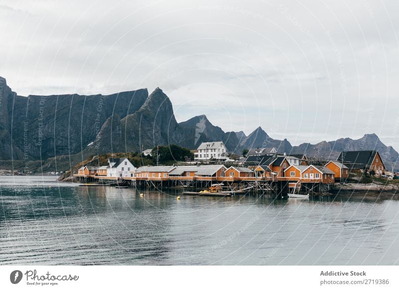 Boats on mountain lake Watercraft Lake Village Mountain Nature Landscape House (Residential Structure) breathtaking Coast Sky Vantage point Majestic Calm Peak