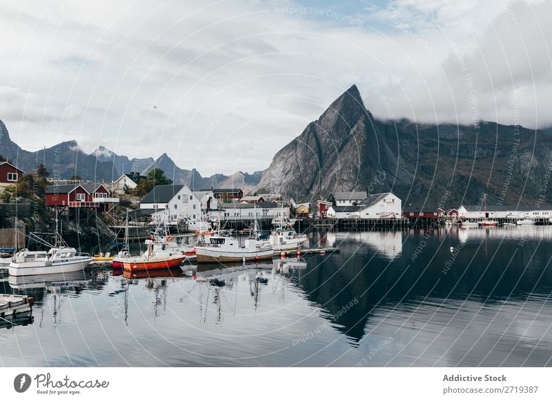 Boats on mountain lake Watercraft Lake Village Mountain Nature Landscape House (Residential Structure) breathtaking Coast Sky Vantage point Majestic Calm Peak