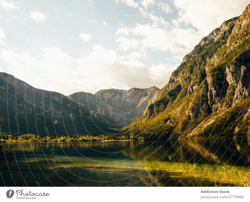 Breathtaking view of lake in mountains Lake Mountain Sunlight Landscape Reflection Calm Water Panorama (Format) Natural Environment Surface scenery Peaceful