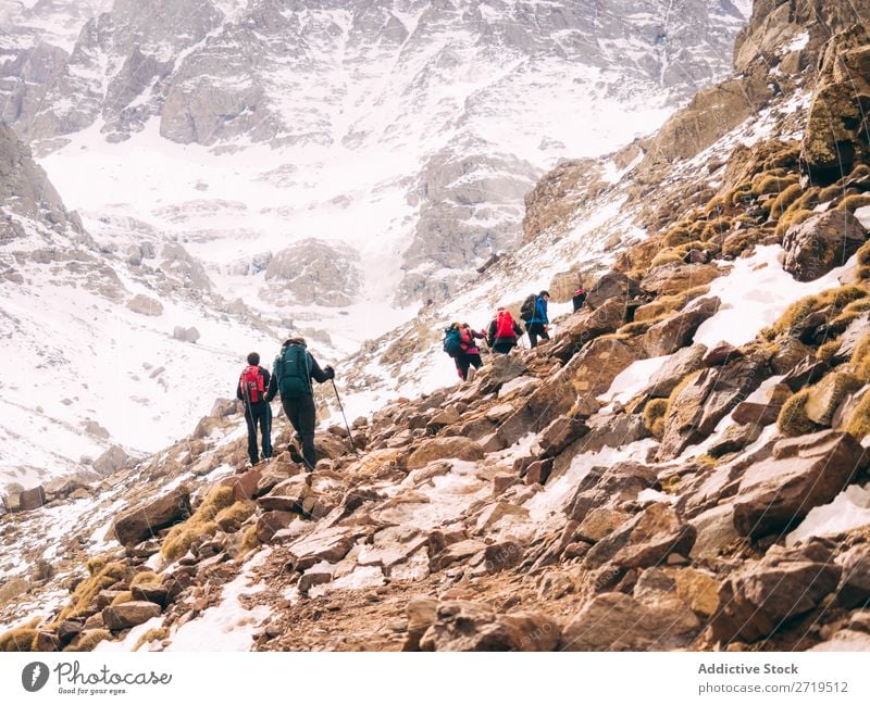 Tourist walking in mountains Human being Mountain Lanes & trails trekking Tourism Winter Landscape Rock Hiking Snow Walking Nature Vacation & Travel