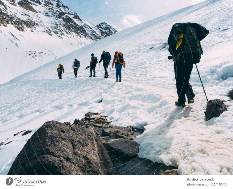 People on snowy downhill Human being Mountain Tourism Winter Landscape Rock trekking Hiking Snow Lanes & trails Walking Vacation & Travel Nature