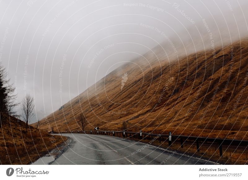 Road in foggy mountains Mountain Clouds Street Asphalt Fog Grass Dry Nature Landscape Natural Vacation & Travel Rock Tourism Stone Scotland Vantage point Yellow