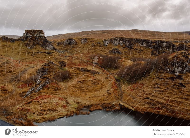 Hills at lake shore Coast Rock Lake Mountain Landscape Nature Water Natural Stone Beautiful Clouds Scotland Grass Vacation & Travel Cliff Vantage point coastal