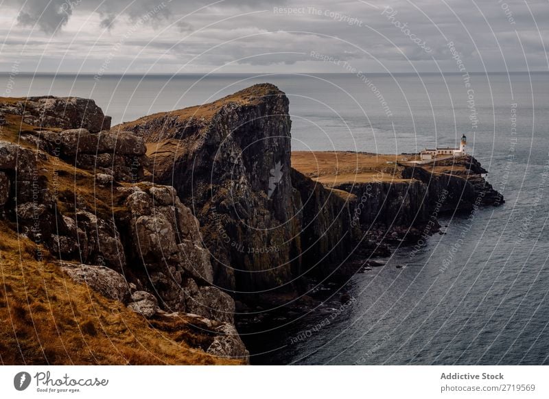 Beacon on coastal hill Coast Rock seascape Hill Mountain Ocean Landscape Nature Water Natural Stone Beautiful Lighthouse Clouds Scotland Grass Vacation & Travel