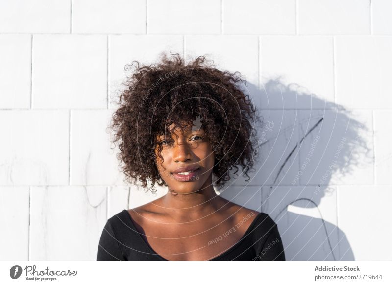 Ethnic woman at white wall Woman pretty Beautiful Youth (Young adults) Portrait photograph Human being Attractive Curly Black Face Nationalities and ethnicity