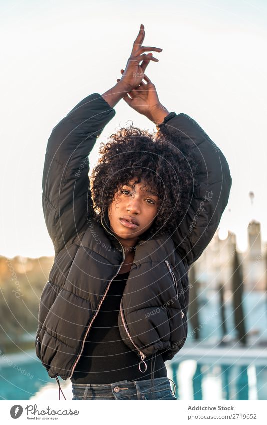 Young ethnic woman with hands up Woman Ethnic pretty Beautiful Youth (Young adults) City Park Sit Fence Style Easygoing Cool (slang) Portrait photograph