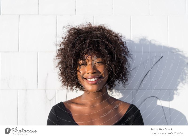 Ethnic woman at white wall Woman pretty Beautiful Youth (Young adults) Portrait photograph Human being Attractive Curly Black Face Nationalities and ethnicity