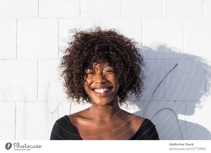 Ethnic woman at white wall Woman pretty Beautiful Youth (Young adults) Portrait photograph Human being Attractive Curly Black Face Nationalities and ethnicity