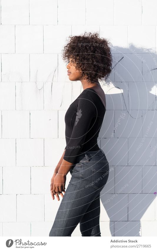 Ethnic woman at white wall Woman pretty Beautiful Youth (Young adults) Portrait photograph Human being Attractive Curly Black Face Nationalities and ethnicity