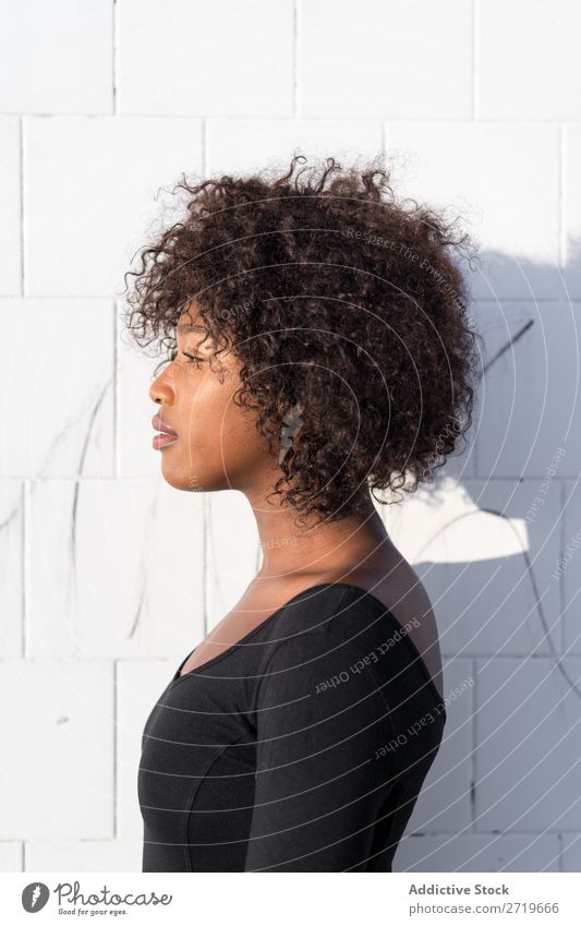 Ethnic woman at white wall Woman pretty Beautiful Youth (Young adults) Portrait photograph Human being Attractive Curly Black Face Nationalities and ethnicity