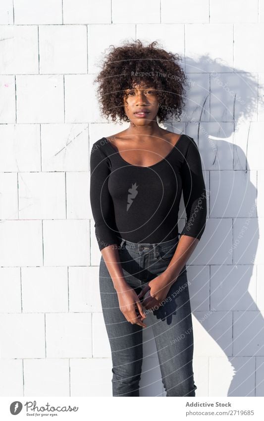 Ethnic woman at white wall Woman pretty Beautiful Youth (Young adults) Portrait photograph Human being Attractive Curly Black Face Nationalities and ethnicity