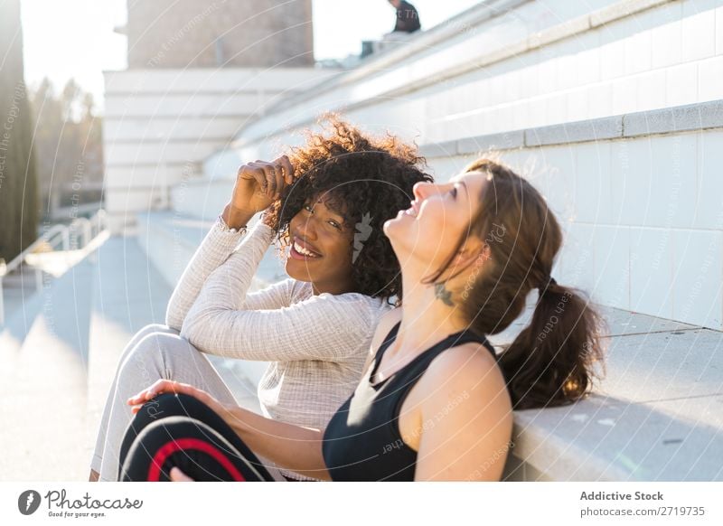 Happy friends sitting on steps Woman pretty Beautiful Youth (Young adults) Sit Steps Looking into the camera Cool (slang) City Town Style Portrait photograph