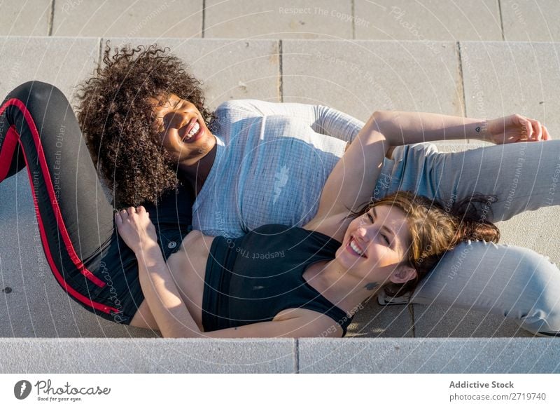 Happy friends sitting on steps Woman pretty Beautiful Youth (Young adults) Sit Steps Looking into the camera Cool (slang) City Town Style Portrait photograph