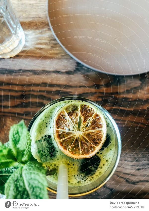 Top view of green salad with a green juice bio Cellphone Straw Drinking Table Yellow Towel jar Food Detox Eating Milkshake Juice blended Vegan diet Organic