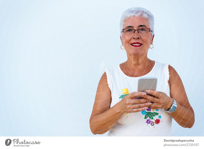 Happy elderly woman on the mobile phone Woman grey hair Old Portrait photograph Beauty Photography retired Human being Senior citizen Communication Relaxation