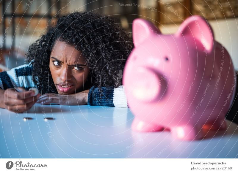 Thoughtful confused black woman with piggy bank Woman Money box Considerate debt Crisis Expression Irritation mistake Sadness Budget worried disappointed