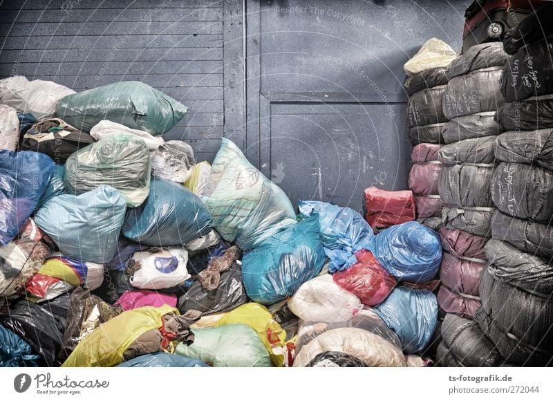 Bags for Africa Deserted Warehouse Wall (barrier) Wall (building) Clothing clothing collection Old clothes Sack of old clothes Packaging Bundle Garbage bag