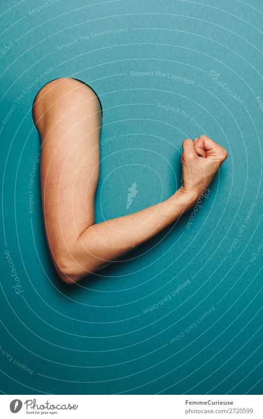 Arm of a woman with a sporty gesture Feminine Woman Adults 1 Human being Stationery Paper Sports Musculature Nerviness Tension Turquoise Fist Concentrate Circle