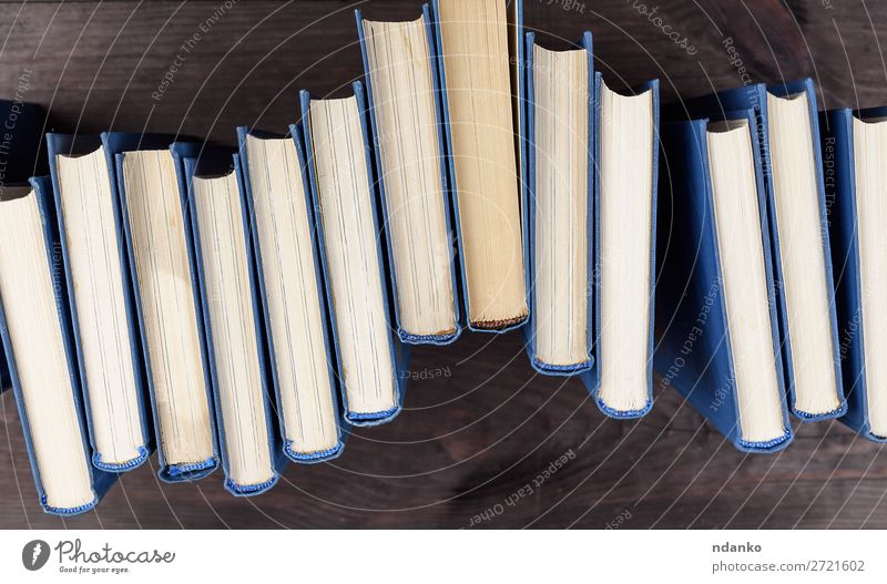 stack of books in a blue cover Reading Table Science & Research School Academic studies Group Book Library Paper Collection Wood Blue Brown Yellow Wisdom