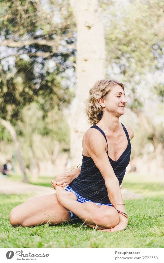 Pretty woman doing yoga exercises in the park. Lifestyle Happy Beautiful Body Health care Wellness Harmonious Relaxation Leisure and hobbies Summer Sports Yoga