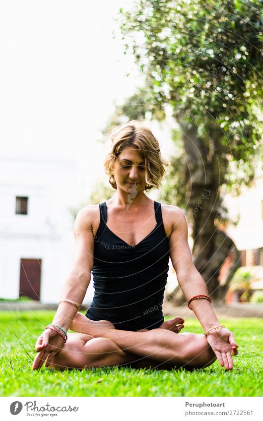 Woman Meditating And Practicing Yoga, Padmasana. Lifestyle Beautiful Body Wellness Harmonious Relaxation Meditation Adults Nature Park Fitness Sit Thin Action