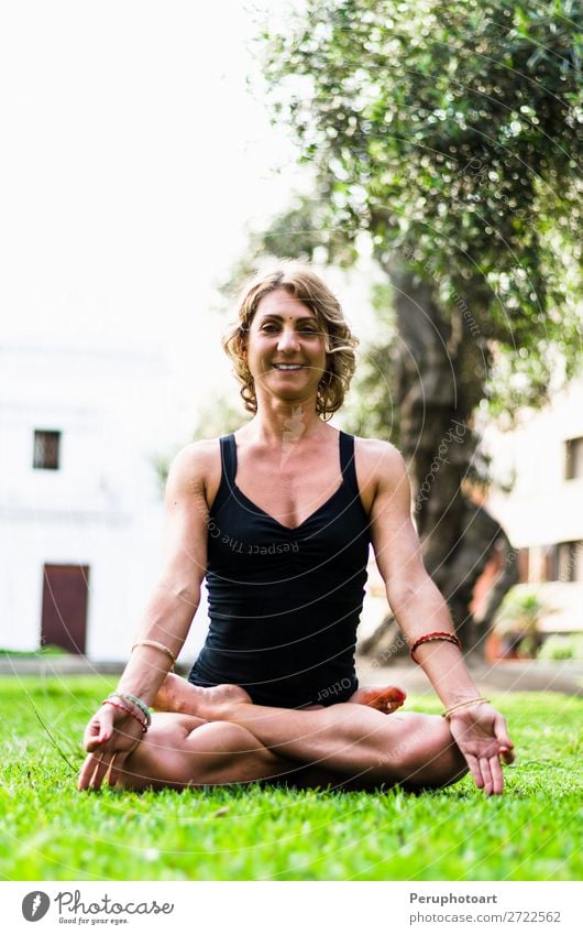 Woman Meditating And Practicing Yoga, Padmasana. Lifestyle Beautiful Body Wellness Harmonious Relaxation Meditation Adults Nature Park Fitness Sit Thin Action