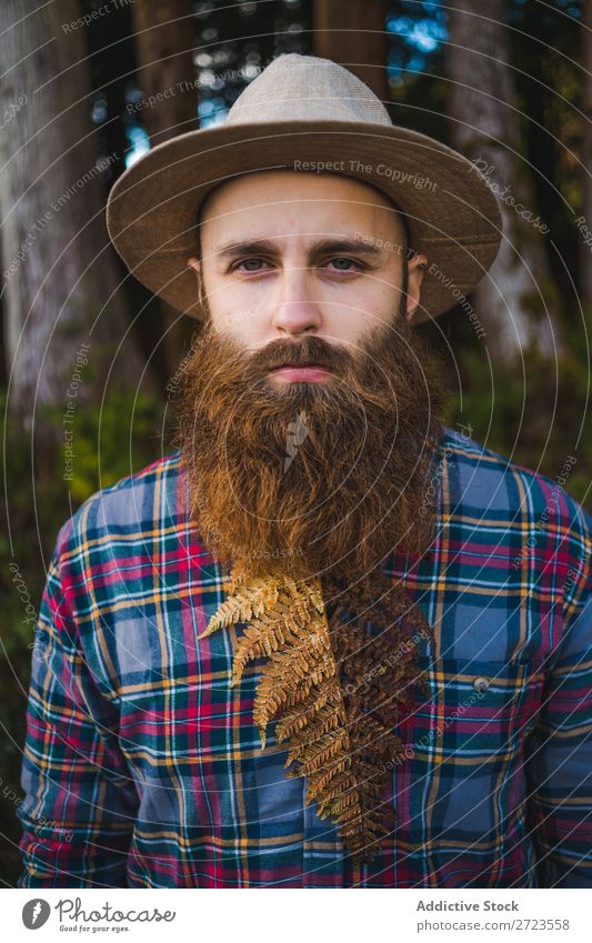 Man with brown leaf in beard Tourist Nature bearded Leaf Brown Conceptual design Hat Forest Green Vacation & Travel Adventure Landscape Azores Hiking