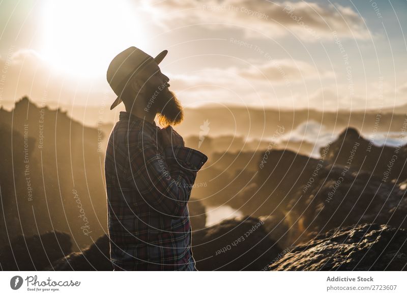 Tourist standing on cliff in sunny day Nature Man bearded Hill Cliff Mountain Sunset Evening Silhouette Vacation & Travel Adventure Landscape Azores Hiking