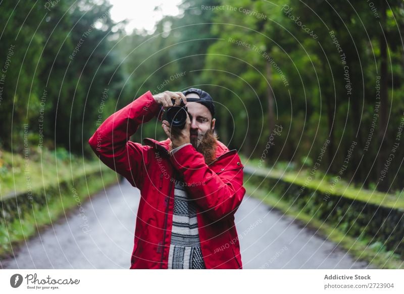 Bearded man taking shots in forest Tourist Nature Camera Photographer shooting focusing Man bearded Forest Green Vacation & Travel Adventure Azores Landscape