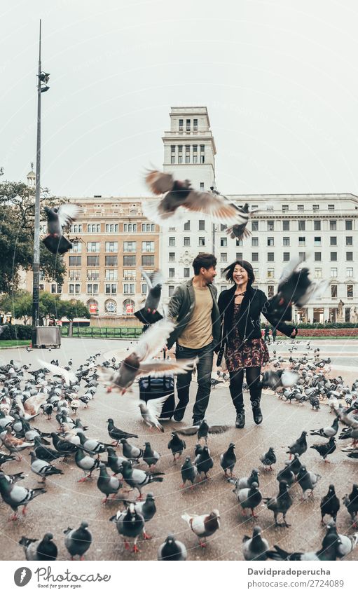 Asian happy tourist couple running with suitcase Couple asian Spain Joy Friendship Tourism Barcelona Vacation & Travel Relationship Europe Architecture Cheerful