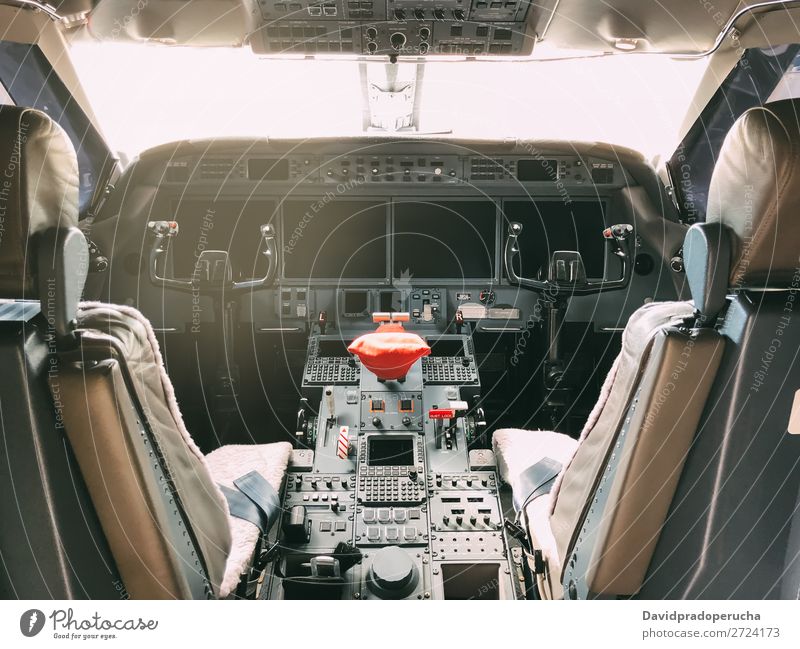 Interior of a pilot cockpit cabin private jet Cockpit Buttons flight deck Interior design Jet Private Screen Luxury Aviation Seat Technology Close-up Hut