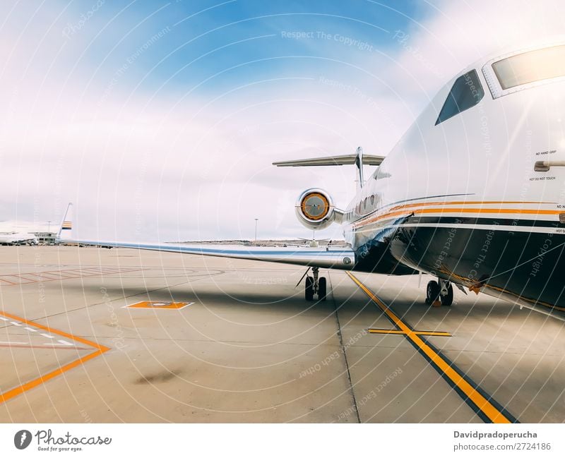 Private luxury jet at the airport terminal Jet Luxury Aviation business class Exclusive Airport Aircraft Airplane Clouds Business Transport Sky Story Runway