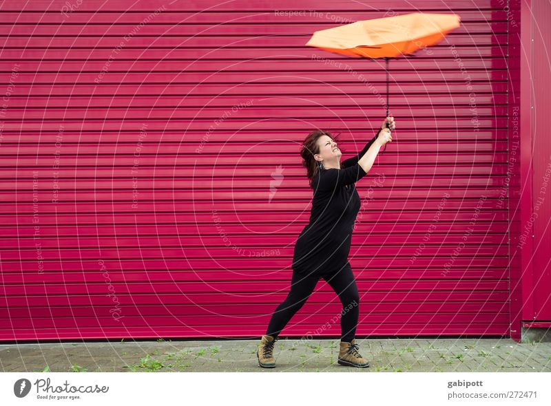 UT S/HD 2012 / stormy times Human being Feminine Woman Adults 30 - 45 years To hold on Wild Orange Pink Red Effort Bizarre Weather Gale Umbrella Rain Fight