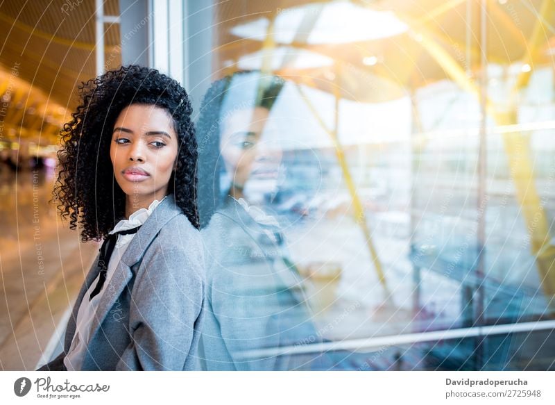 Thoughtful black woman waiting at airport Lifestyle Happy Beautiful Vacation & Travel Trip Business Human being Woman Adults Airport Departure lounge Suitcase