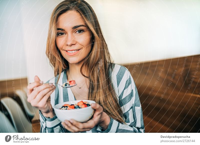 woman close up eating oat and fruits bowl for breakfast Beautiful Blueberry Bowl Breakfast Cereal Close-up Crops Dairy Delicious Dessert Diet To feed Eating