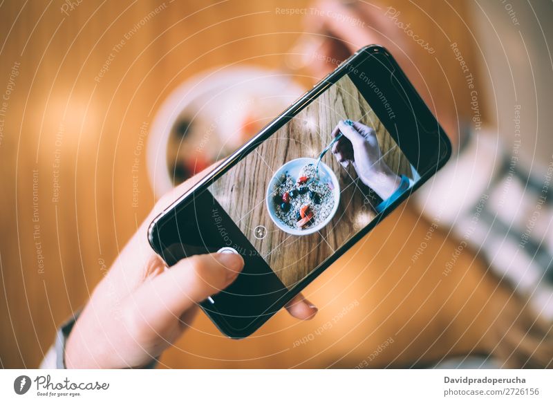 Woman taking photo of a bowl breakfast oats and fruit Photography Shot Mobile PDA Telephone Illustration Take Bowl Strawberry Breakfast Cereal porridge