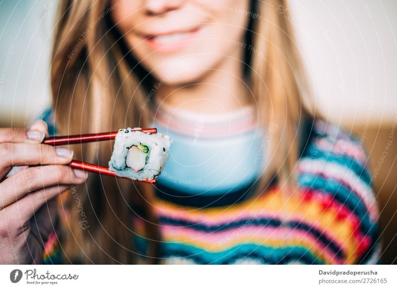 Crop woman eating sushi Sushi Woman Smiling Hand Food soy maki california roll Chopstick Roll Crops Unrecognizable Anonymous Close-up Portrait photograph Salmon