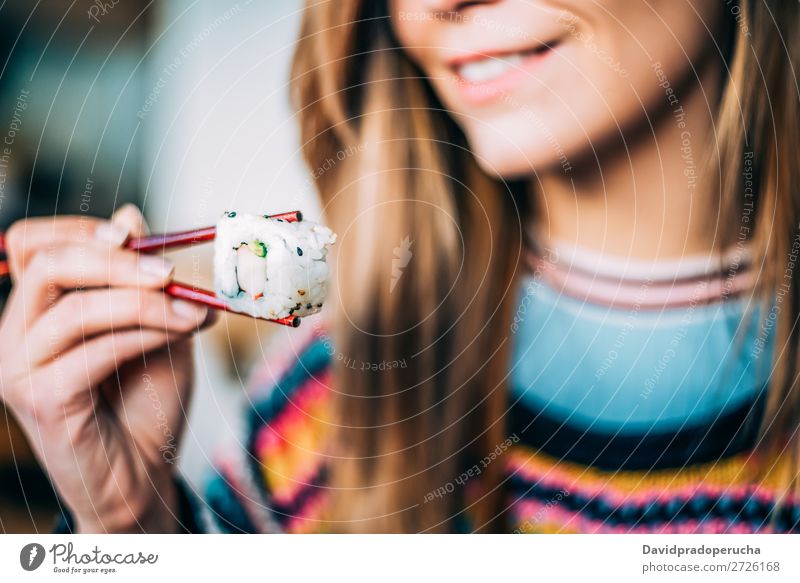 Crop woman eating sushi Sushi Woman Smiling Hand Food soy maki california roll Chopstick Roll Crops Unrecognizable Anonymous Close-up Portrait photograph Salmon