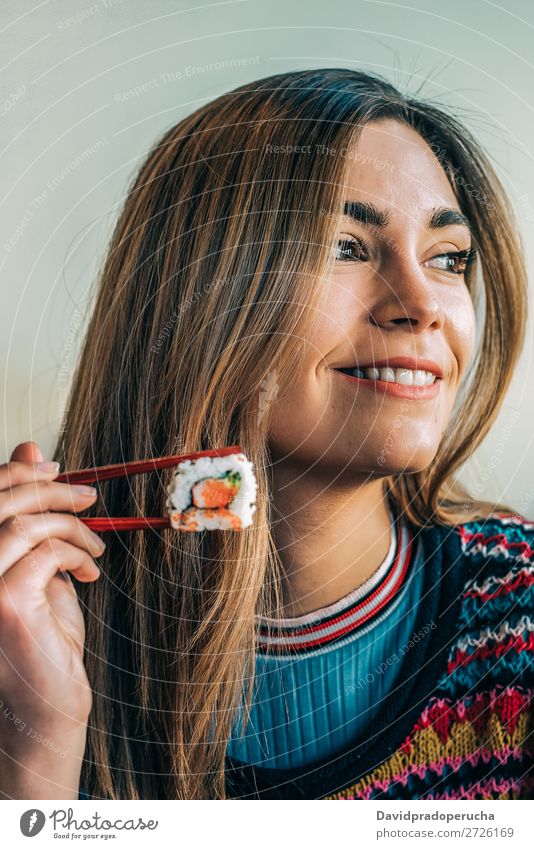 Woman eating sushi Japanese Attractive Beautiful Beauty Photography Blonde california roll Caucasian Chopstick Close-up Delicious Diet Dinner To feed Eating