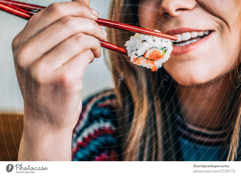 Crop woman eating sushi Sushi Woman Smiling Hand Food soy maki california roll Chopstick Roll Crops Unrecognizable Anonymous Close-up Portrait photograph Salmon