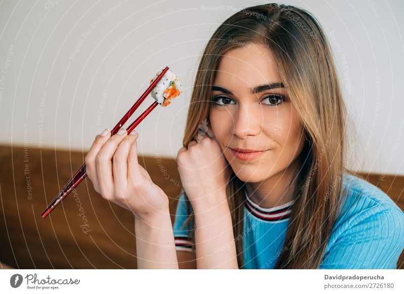 Crop woman eating sushi Sushi Woman Smiling Hand Food soy maki california roll Chopstick Roll Crops Unrecognizable Anonymous Close-up Portrait photograph Salmon