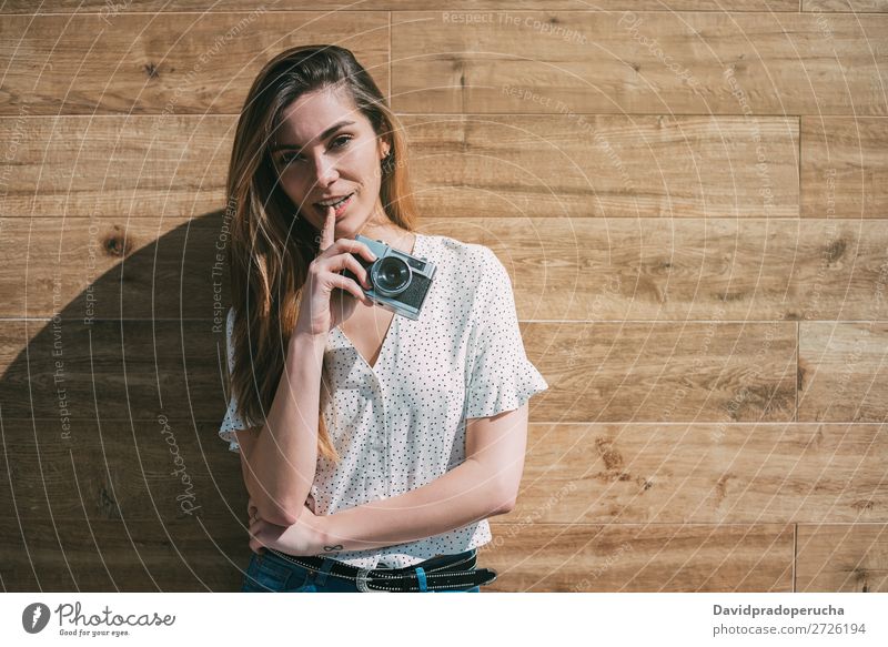 Beautiful woman with vintage old camera standing at a wood wall Vintage Camera Retro Woman Old Youth (Young adults) reel Portrait photograph Photography Smiling