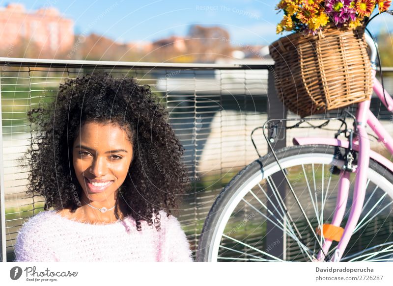 Black young woman sitting by the river with her vintage bicycle Bicycle Girl Beautiful Retro Flower Happy Vintage Bouquet Pink Summer Youth (Young adults) Woman