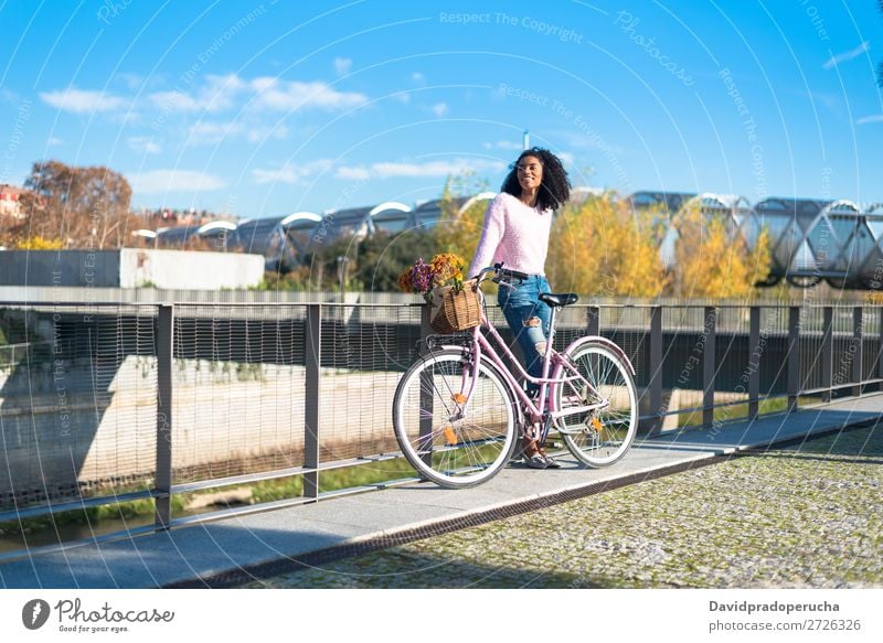 Black young woman riding a vintage bicycle Bicycle Girl Woman Vintage Ride Beautiful Retro Flower Sunbeam Happy Bouquet Summer Youth (Young adults) pretty